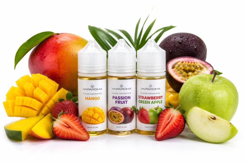Fruits tropicaux frais aux côtés de concentrés de saveurs d'e-liquide professionnels, illustrant les associations sensorielles et perceptuelles entre l'imagerie de fruits naturels et les effets halo de santé des consommateurs dans l'évaluation des produits de vapotage.